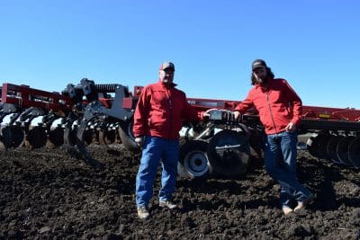 Dave Marten and Pete McCann with the Ecolo-Tiger 875 tillage machine. 