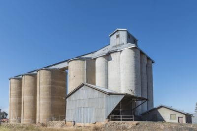 Grain silos against blue sky, Narromine, New South Wales, Australia. Horizontal.