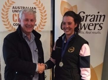 Australian Universities Crops Competition winner, University of Sydney student, Nellie Evans, is congratulated by GrainGrowers general manager, Michael Southan.