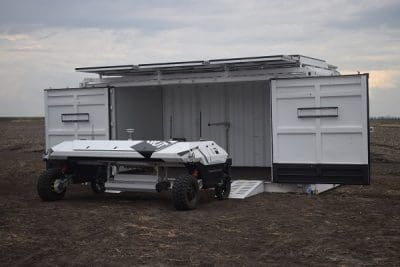 The robot uses its laser guidance system to reverse into the custom-made container where it automatically docks to recharge its batteries.