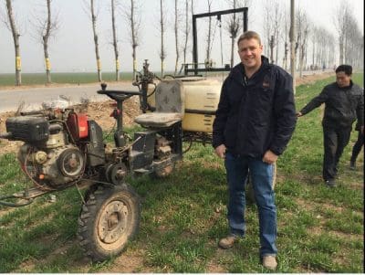 Adam McVeigh with a common self-propelled sprayer in China.