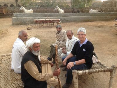 Pulse Australia agronomist Phil Bowden (right) met with farmers in Khunda, Pakistan, to discuss the new pulse improvement project.