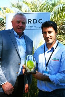 GRDC northern panel chair John Minogue congratulates Barry Haskins on being presented with the 2017 Seed of Light award.